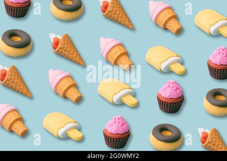 Creative pattern of desserts and sweet food. popsicles, ice cream, donuts, cupcakes on blue background. Summer and candy concept. Illustration 3d. Stock Photo