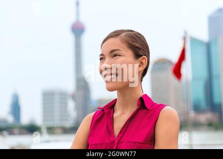 Business woman portrait in Shanghai China showing Pudong financial district Stock Photo