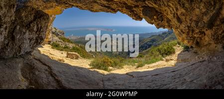 View of the Punta de la Banya of the Ebro delta, seen from the Foradada cave, in Serra de Montsià range (Tarragona, Catalonia, Spain) Stock Photo