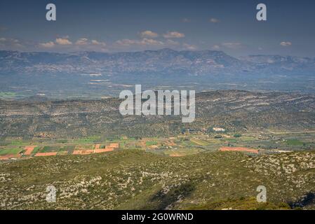 Views from the Torreta de Montsià summit towards the Montsià region. In the background, the Ports mountains (Tarragona, Catalonia, Spain) Stock Photo