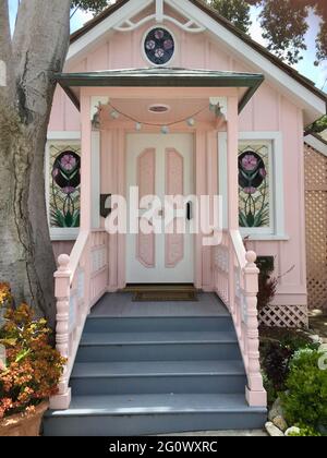 Victorian 1800s tiny house with stained glass windows Stock Photo