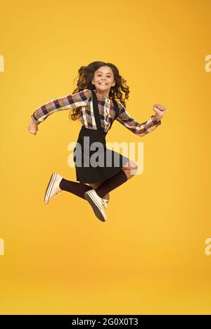 Time for fun. Active girl feel freedom. Fun and jump. Happy childrens day. Jump concept. Break into. Feel inner energy. Girl with long hair jumping on Stock Photo
