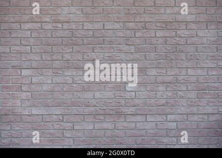 Texture brick wall from plastic panels for facade decoration Stock Photo