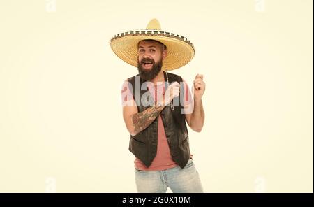 Mexican melody drives him. Man bearded cheerful guy wear sombrero mexican hat. Mexican party concept. Celebrate traditional mexican holiday. Guy happy Stock Photo