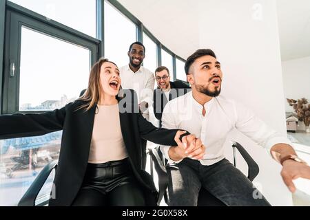 Multiracial work colleagues having fun during the break Stock Photo