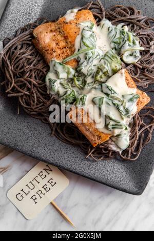 Pasta with salmon and blue cheese served rosemary Stock Photo - Alamy