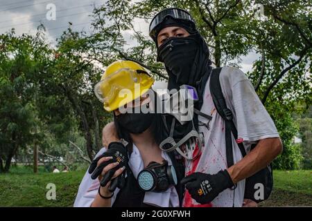 Medellin, Antioquia, Colombia. 2nd June, 2021. Members of the front line covering their faces pose for photos as anti-government protests rise into a 5th week against the government of president Ivan Duque's health and tax reform, and police abuse of authority cases in Medellin, Colombia on June 2, 2021. Credit: Miyer Juana/LongVisual/ZUMA Wire/Alamy Live News Stock Photo