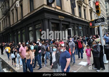 New York, USA. 03rd June, 2021. A large crowd gathers in front of the new Harry Potter Flagship store in Manhattan's Flatiron District in New York on Thursday June 3, 2021. The three floor 21,000 square ft. retail experience will house the largest collection of Harry Potter and Fantastic Beasts products under one roof. Photo/ Louis Lanzano/Sipa USA Credit: Sipa USA/Alamy Live News Stock Photo