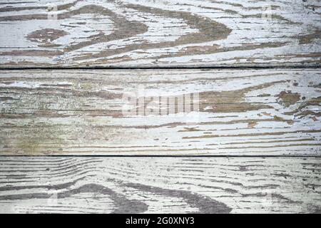 Old weathered and aged wood panel boards with peeling paint and algae growth dirty grunge top view texture Stock Photo