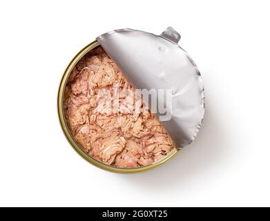 Canned tuna meat in a large half open tin isolated on white background. Preserved tuna fish ingredient of low calories salads and healthy eating. Stock Photo