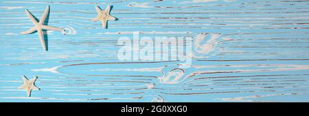 Starfish seashells on a wooden blue background Stock Photo