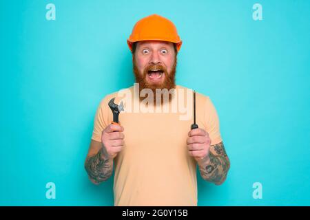 Incompetent worker is afraid and worried about his work Stock Photo