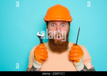 Incompetent worker is unsure and confused about his work Stock Photo