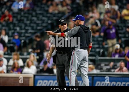 Texas Rangers manager Chris Woodward argus with home plate umpire Larry ...