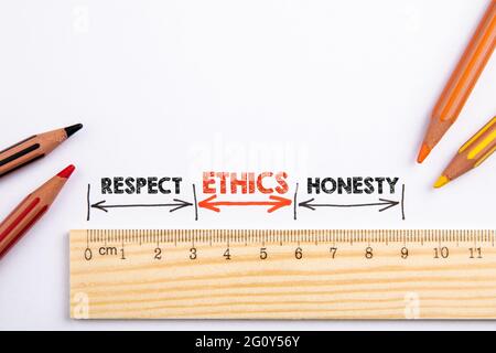 Ethics, Respect and Honesty concept. Wooden liner with colored pencils on a white background. Stock Photo