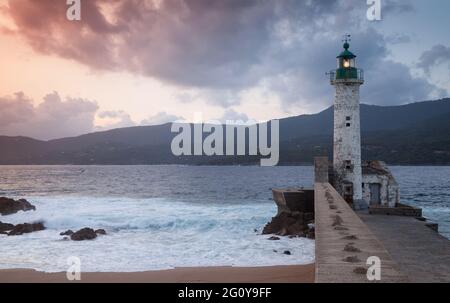 Lighthouse tower on a summer evening. Coastal landscape of Propriano, Corsica island, France Stock Photo