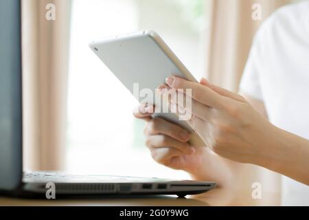 Young businesswoman using his tablet-pc, close up Stock Photo