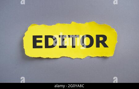 editor word written on on yellow torn paper, concept. Stock Photo