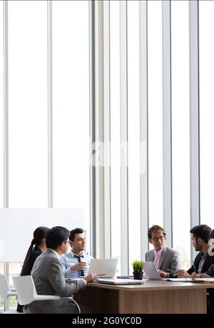 Annual sales summary meeting with the chiefs, secretary, translator and employees from various departments joining in the company, International commu Stock Photo