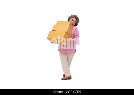 Happy asian senior woman holding package parcel box isolated on white background, Delivery courier and shipping service concept Stock Photo