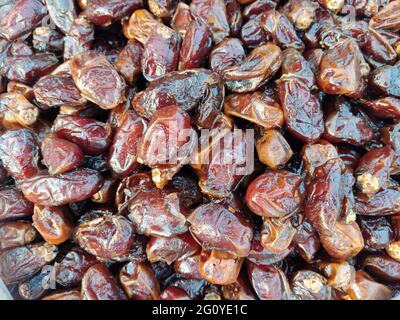 Phoenix dactylifera, commonly known as date or date palm, is a flowering plant species in the palm family, Arecaceae, cultivated for its edible sweet Stock Photo