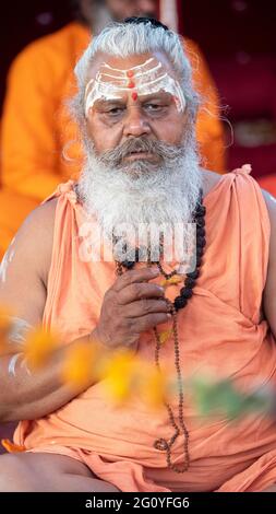 Haridwar, Uttarakhand, India April 12, 2021. Indian Saints in their traditional way of Yog Mudra, meditating. Sitting in silence as part of the initiation of new sadhus during Kumbha Mela. The Naga Sadhus.  Stock Photo