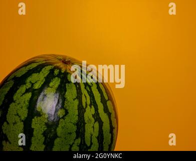 Watermelon isolated on an orange background Stock Photo