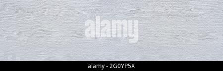 White panoramic wall with horizontal grooved plaster Stock Photo