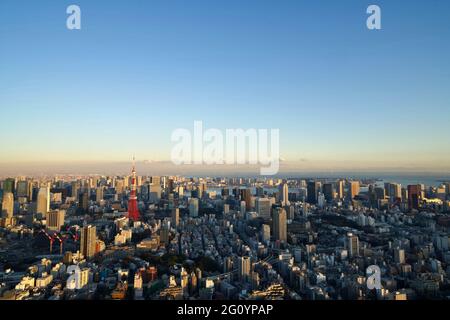 View of Tokyo Skyline and Tokyo Tower, from Mori Tower's Tokyo City View Sky Deck in the evening, Roppongi Hills, Tokyo, Japan Stock Photo