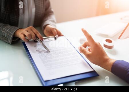 Lawyer Contract Mediation And Review. Two Reading Corporate Document Stock Photo