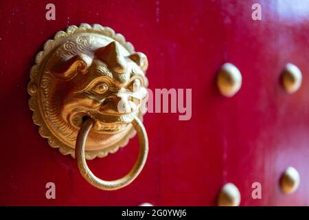 Traditional vintage Ancient architecture doornail and door knocker at temple Stock Photo