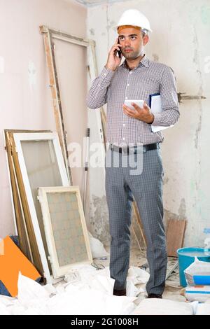 Man engineer talking on the mobile phone Stock Photo