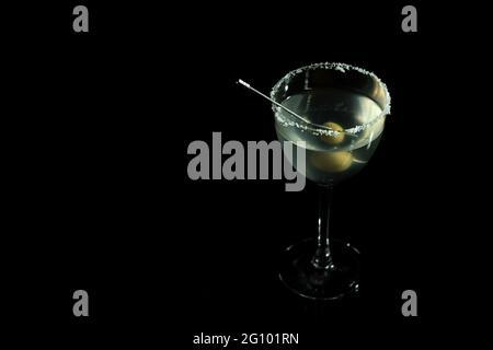 Luxury cocktail glass on black background. High end beverage in bar. Stock Photo