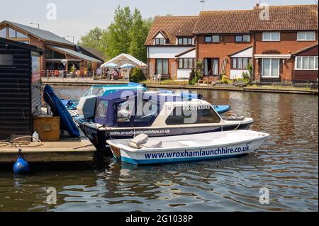 Wroxham Launch hire station with boats all ready to hire for the day or by the hour on the River Bure at Wroxham Norfolk Stock Photo