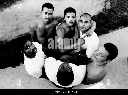 STOCKTON, UNITED STATES - Jul 08, 1993: California Youth Inmates 18-25 years of age, posing for a gang-peace-unity photo.  The p was placed on a anit- Stock Photo