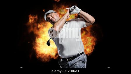 Composition of caucasian male golf player holding golf club over flames on black background Stock Photo