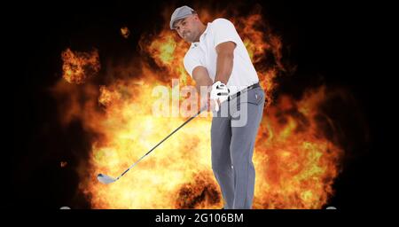 Composition of caucasian male golf player holding golf club over flames on black background Stock Photo