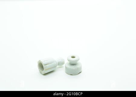 Two small antique insulators on white Stock Photo