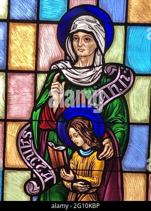 BIOXI, UNITED STATES - Jun 01, 2021: Stained glass window of Saint Anne, mother of Mary, at Our Lady of Victories Church in Pascagoula, Stock Photo