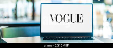 POZNAN, POL - MAY 15, 2021: Laptop computer displaying logo of Vogue, a fashion and lifestyle magazine Stock Photo