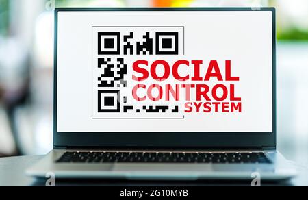 Laptop computer displaying the sign of Social Control System Stock Photo