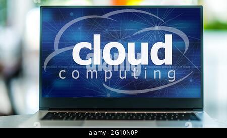 Laptop computer displaying the sign of cloud computing. Stock Photo