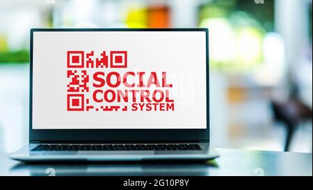 Laptop computer displaying the sign of Social Control System Stock Photo