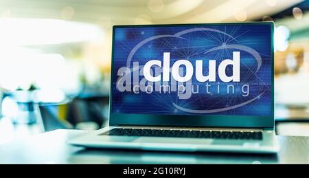 Laptop computer displaying the sign of cloud computing. Stock Photo