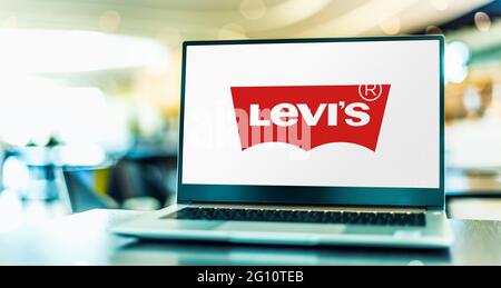 POZNAN, POL - MAY 15, 2021: Laptop computer displaying logo of Levi Strauss, an American clothing company Stock Photo