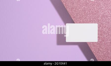 blank rectangular business card lies on a modern purple background sheets of paper with a shadow. Business template, flat lay Stock Photo
