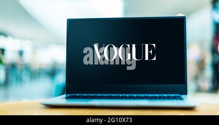 POZNAN, POL - MAY 15, 2021: Laptop computer displaying logo of Vogue, a fashion and lifestyle magazine Stock Photo