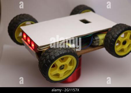 Hand made robot working on IOT platform. Mobile phone controlled robotic car Stock Photo