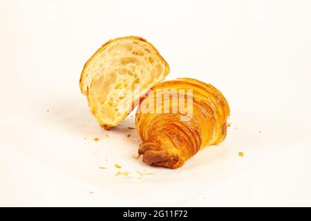 Brioche plain flaky butter croissant crisp and golden in color isolated on white background Stock Photo