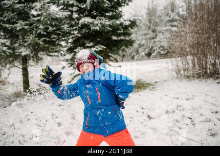 Canada, Ontario, Boy playing in snow Stock Photo